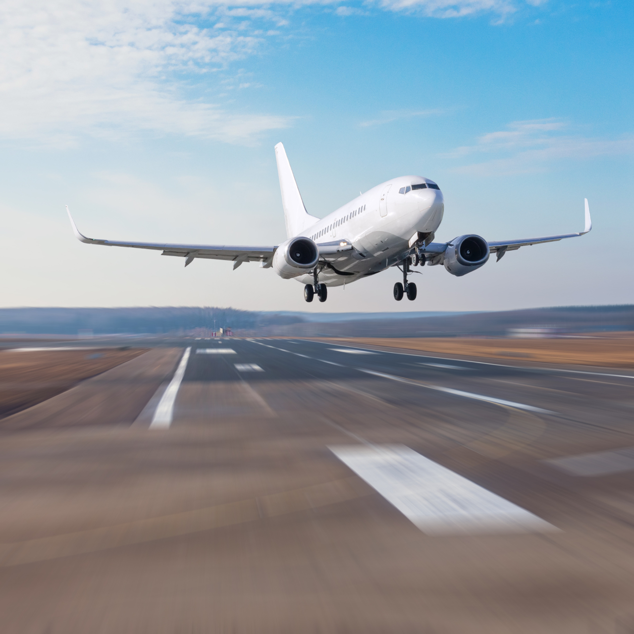 An airplane taking off from a runway