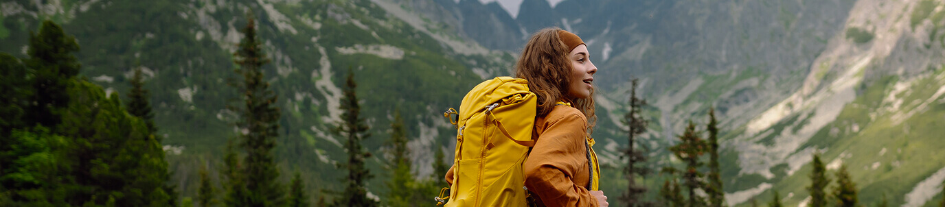 Woman hiking in front of landscape
