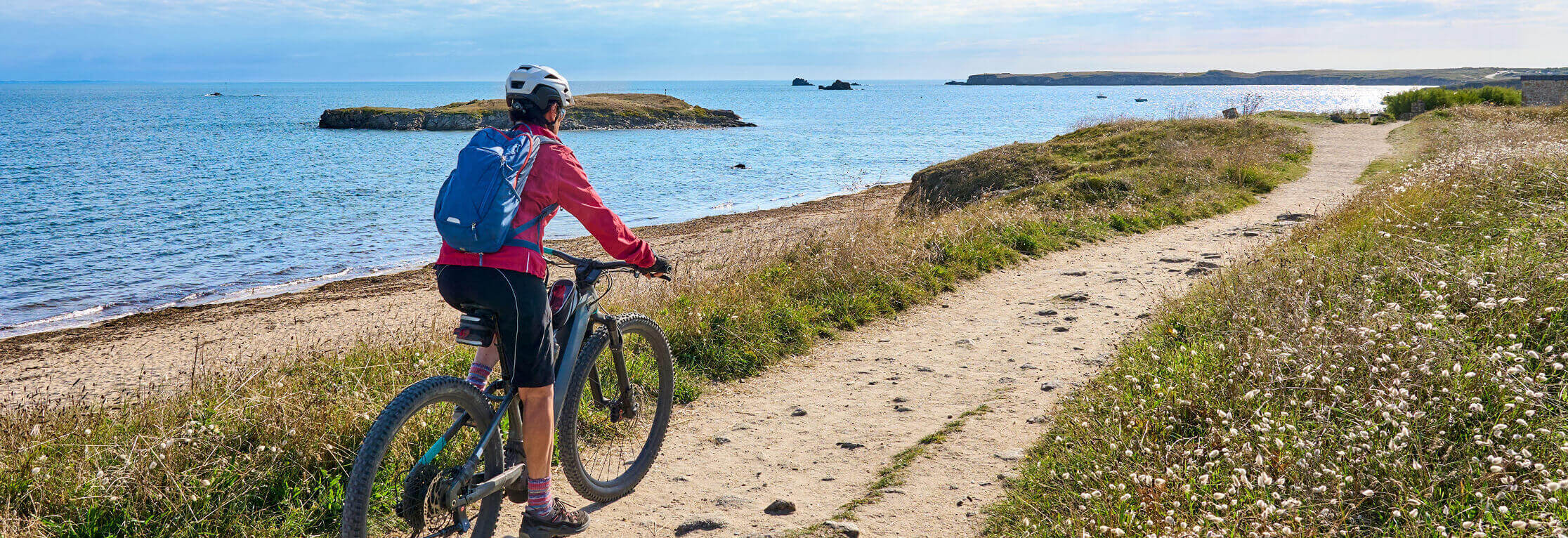 Cyclist riding near the beach