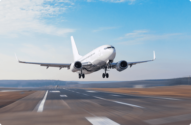 A jumbo jet takes off from a runway