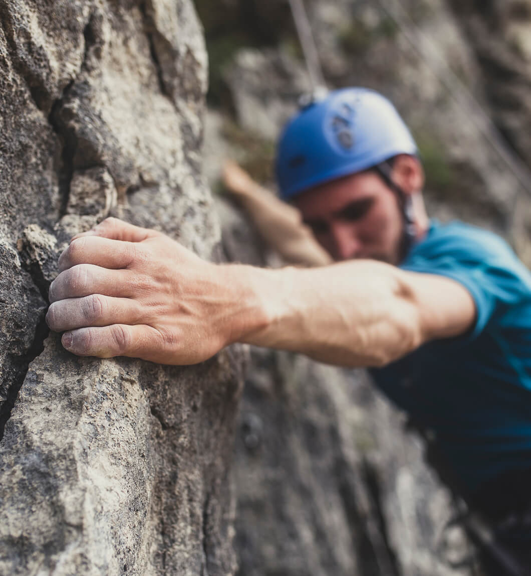 Man climbing rock wall