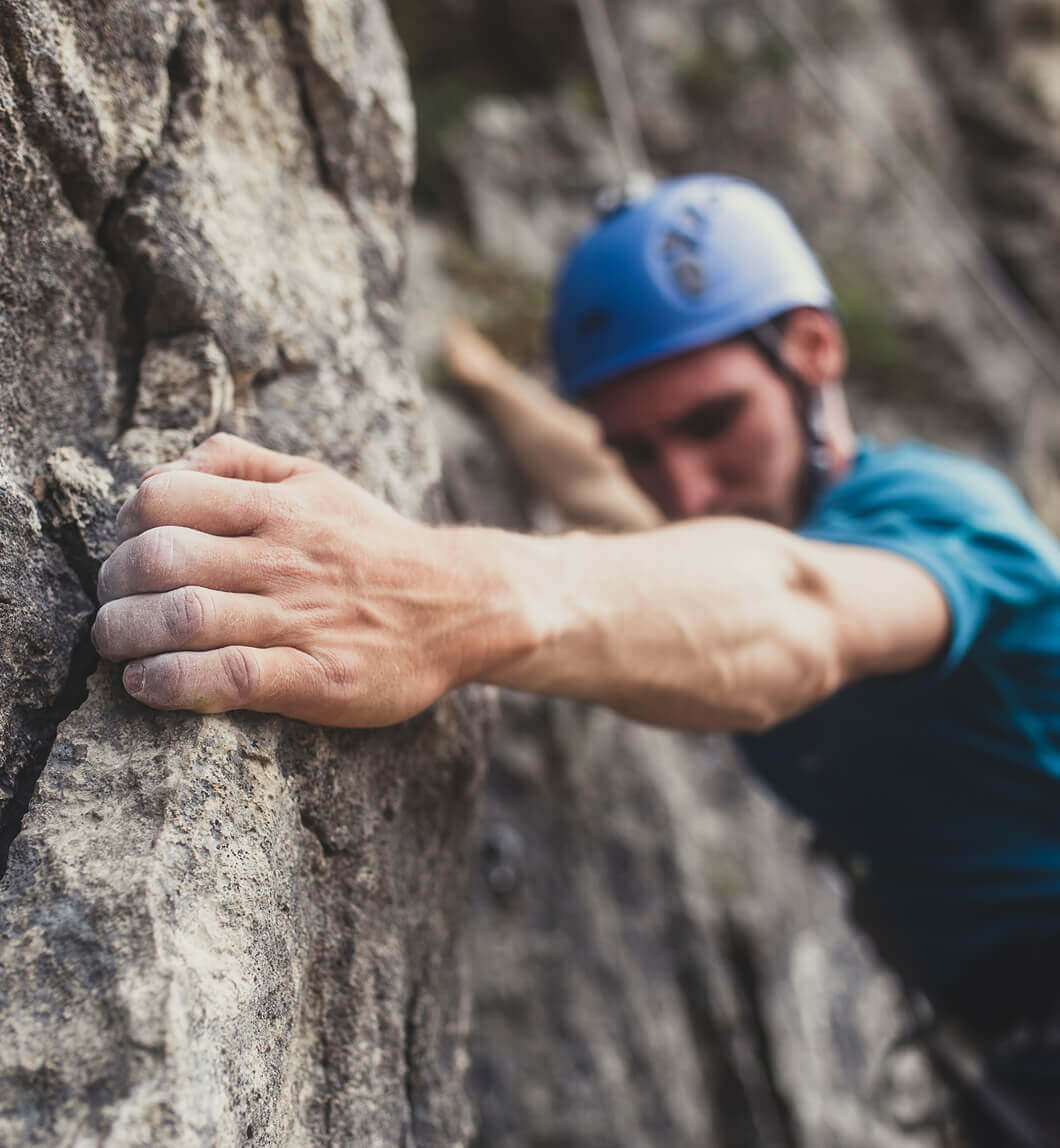 Man climbing rock wall