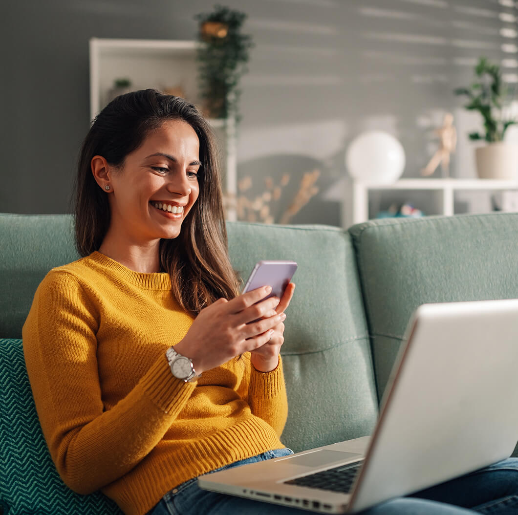 Woman on couch browsing on phone