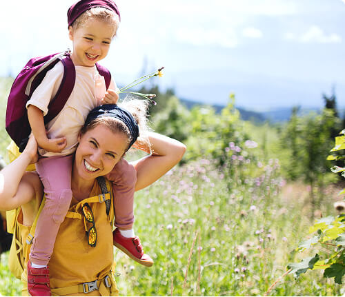 Mother and daughter piggyback