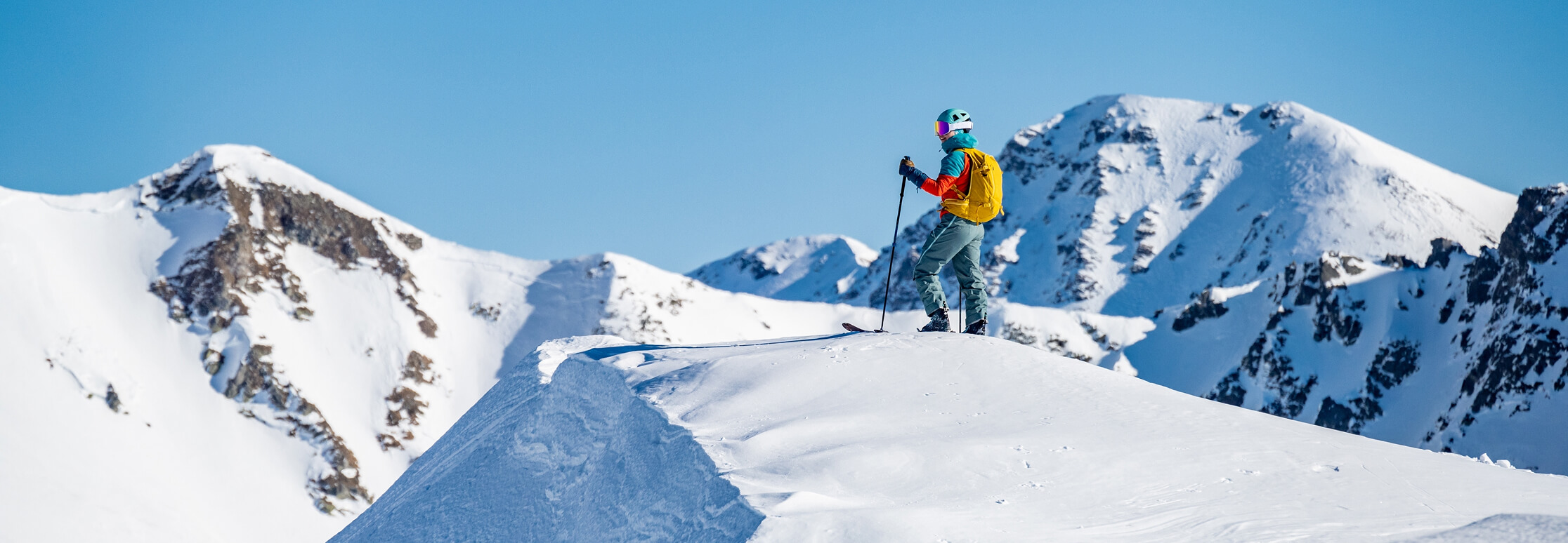 Skier on mountain slopes