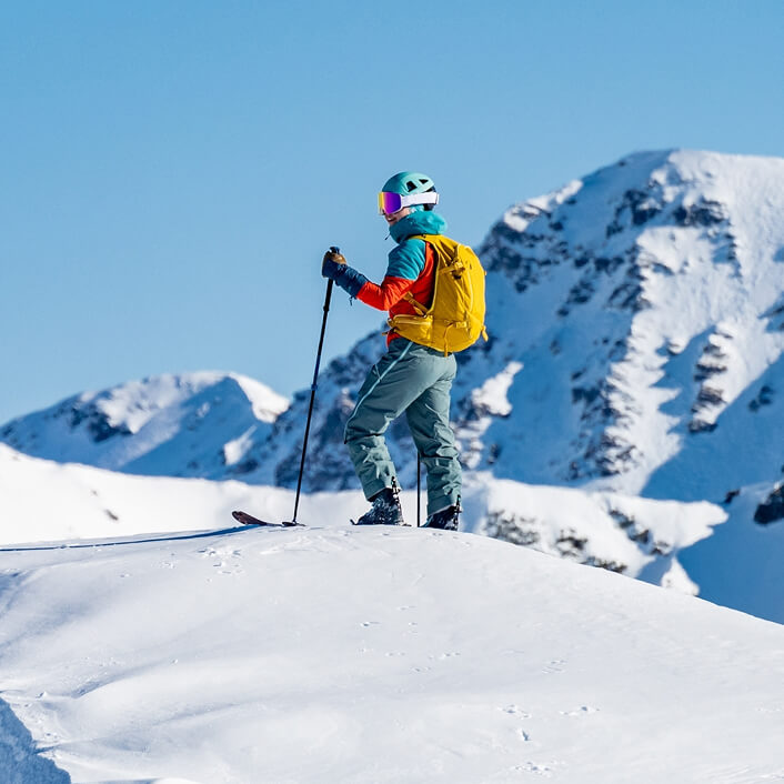 Skier on mountain slopes