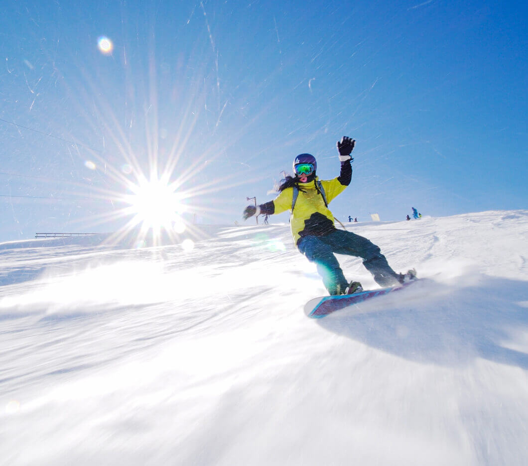 Snowboarder girl on slopes